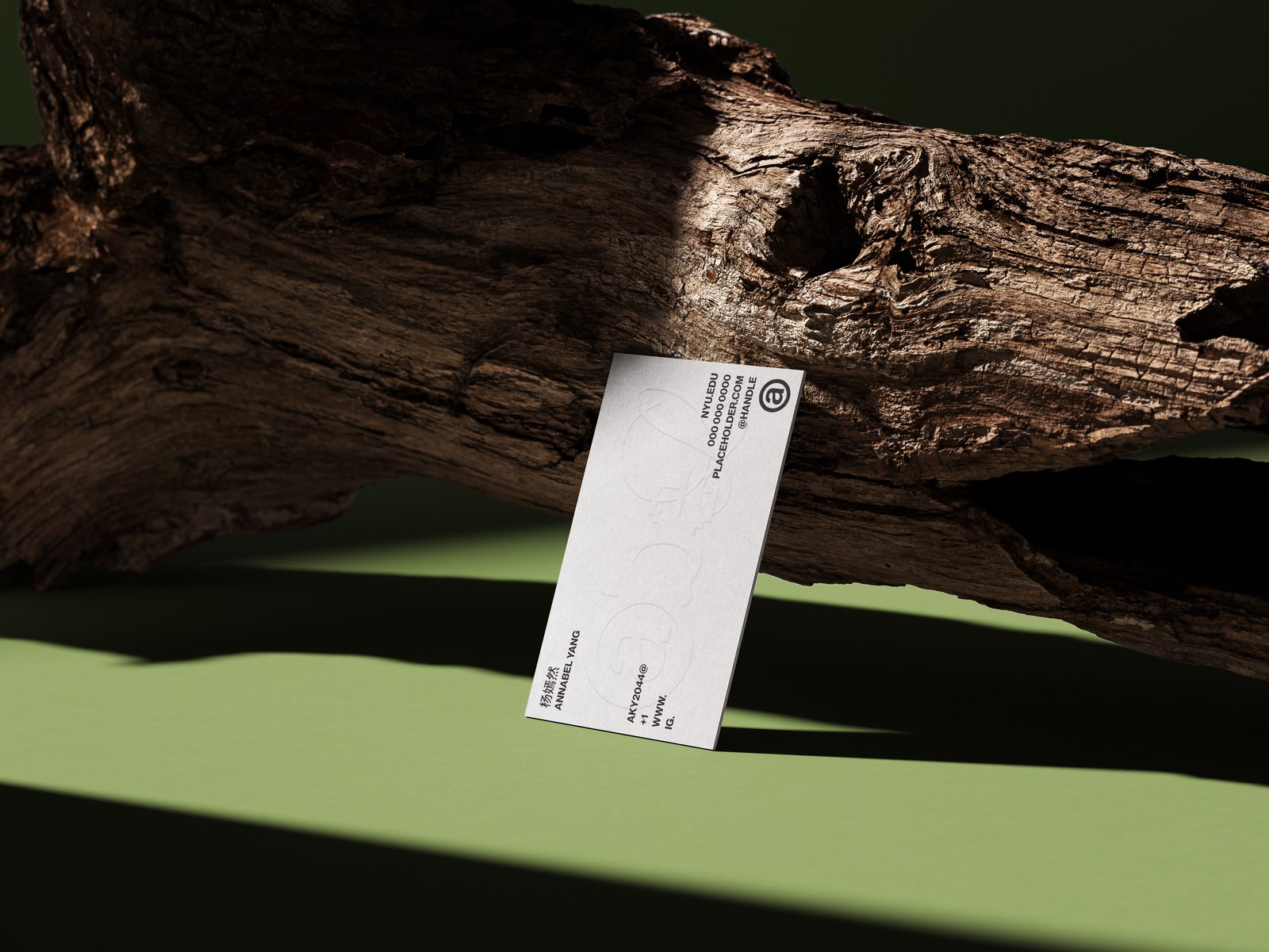 Abel — business card leaning against driftwood