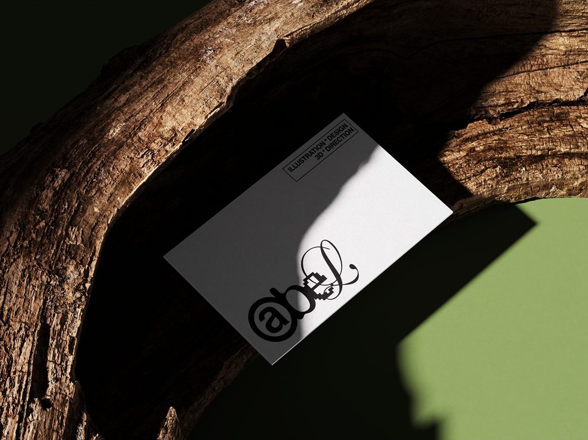Abel business card resting on a branch